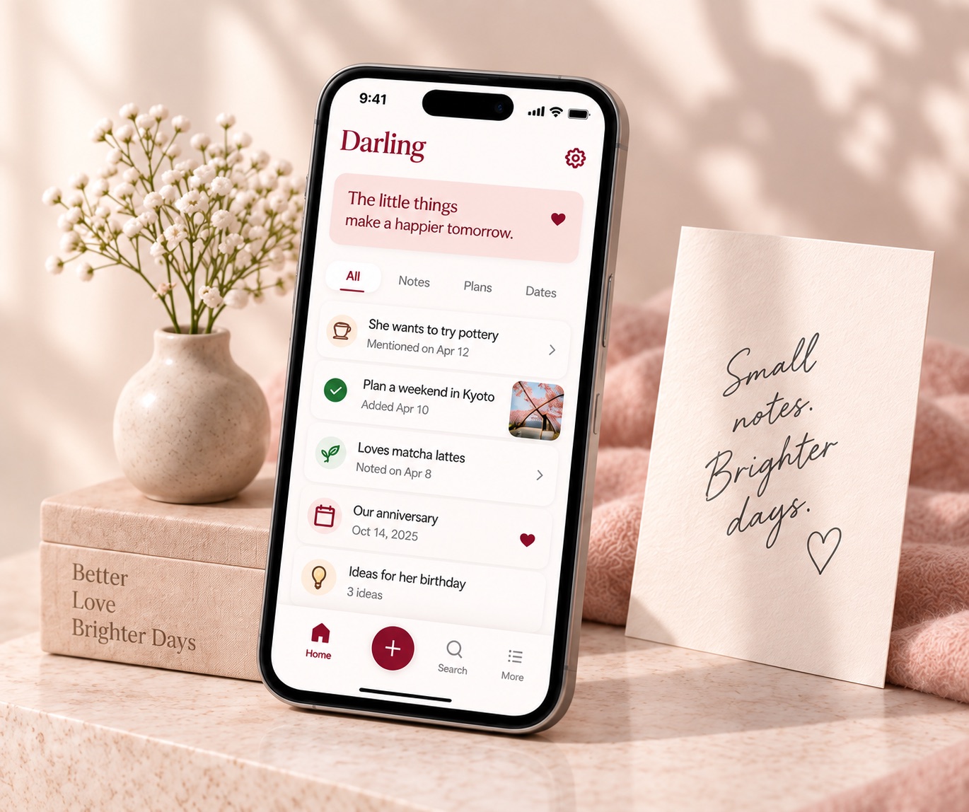 Darling on an iPhone beside a vase of flowers and a card that reads Small notes. Brighter days.